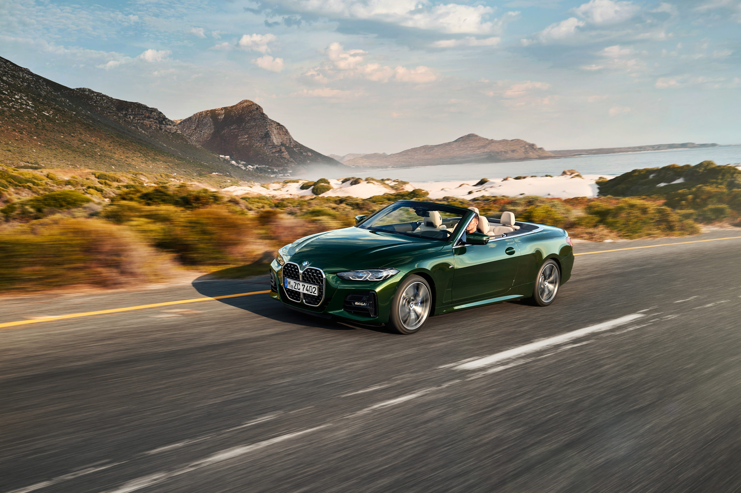 Green 2021 BMW 4 Series Convertible on road